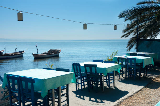 istock Dinner tables near the sea 1179583898