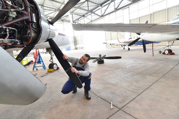 istock Airport workers check an aircraft for safety in a hangar 1179584008