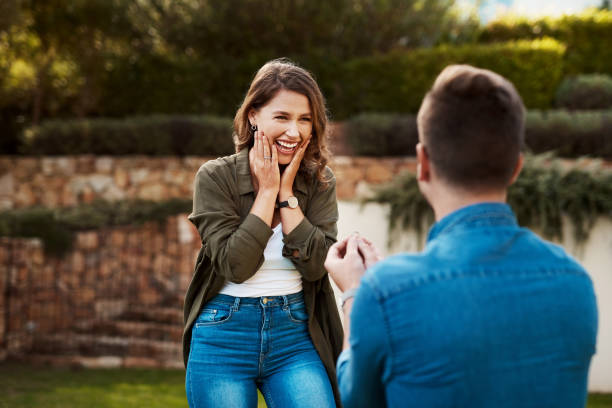 I want us to take the next step Cropped shot of a young man proposing to his girlfriend falling in love photos stock pictures, royalty-free photos & images