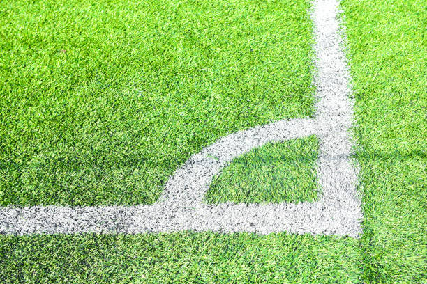 istock white line football corner on green field 1179585199