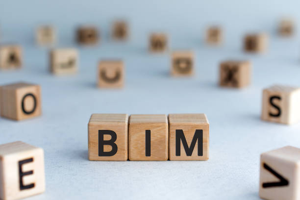 BIM - acronym from wooden blocks with letters BIM - acronym from wooden blocks with letters, abbreviation BIM Building Information Modeling concept, random letters around, white  background building information modeling photos stock pictures, royalty-free photos & images
