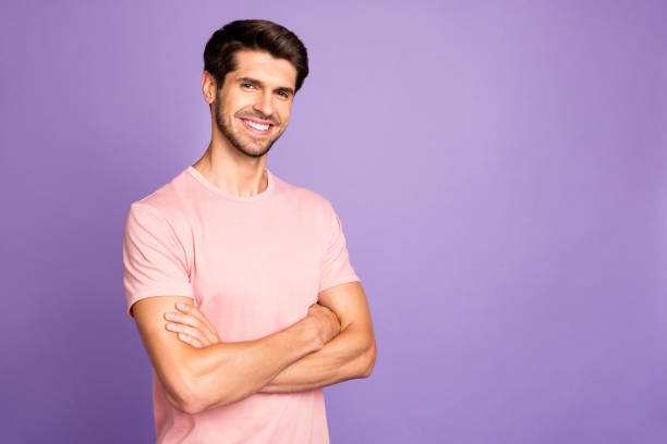 istock Portrait of his he nice attractive handsome cheerful cheery content bearded guy freelancer wearing pink tshirt folded arms isolated over violet purple lilac pastel color background 1179588689