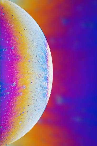 Abstraction background, multi-colored soap bubble in the form of a space planet.