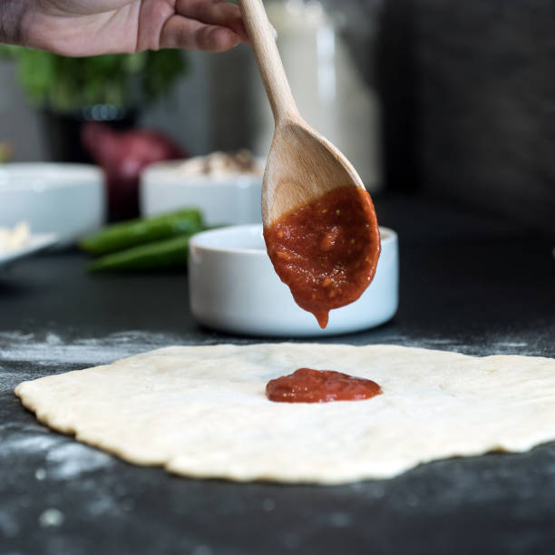 istock making homemade Italian-style pizza 1179591306