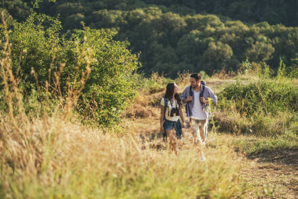 istock Happy couple is hiking in mountain. 1179591530