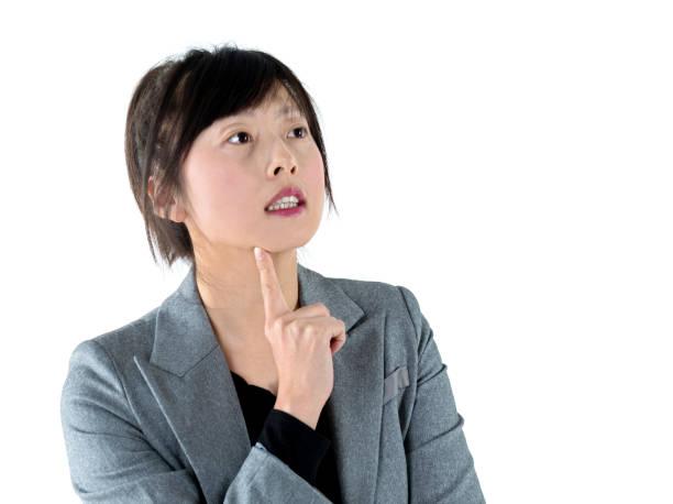 istock Businesswoman thinking and looking up on white background 1179592608