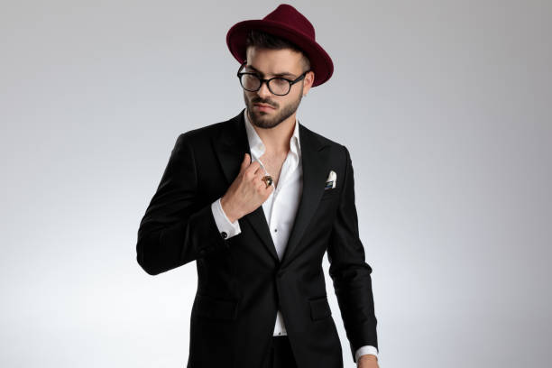 istock businessman looking away pensive and fixing collar 1179592813