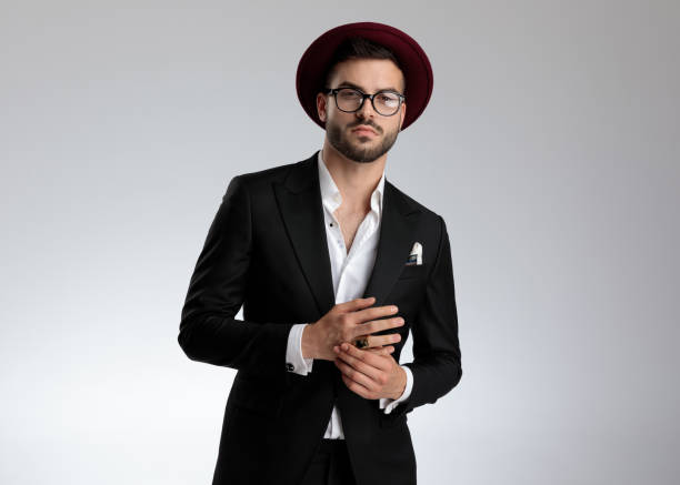 istock businessman holding hands and looking at camera serious 1179593135