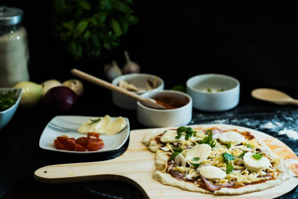istock making homemade Italian-style pizza 1179594366