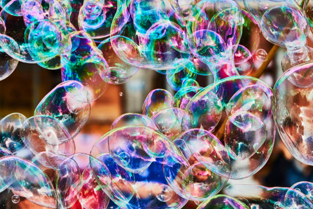istock Metallic glowing colorful soap bubble in the air 1179594398