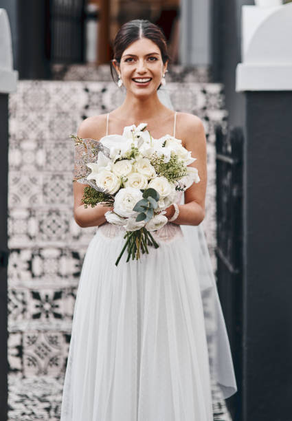 Cropped shot of a beautiful bride standing outside