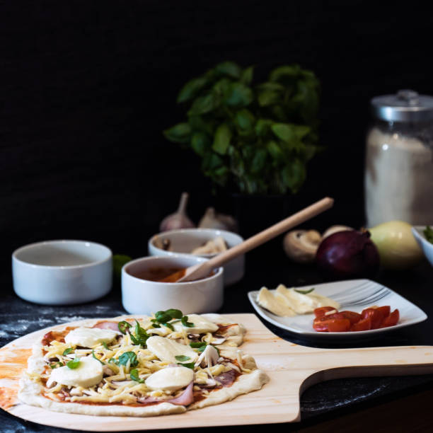 istock making homemade Italian-style pizza 1179594850