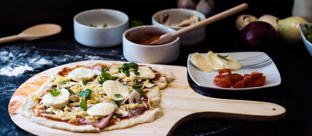 istock making homemade Italian-style pizza 1179595677
