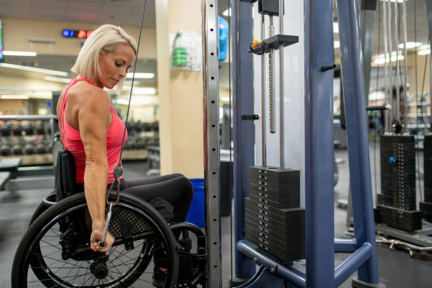 istock Adaptive athlete in a wheelchair working on her triceps 1179595728