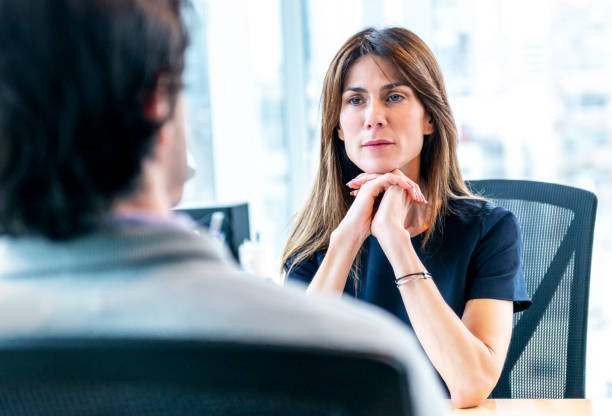 istock Woman Interviewing a man for a job 1179595748
