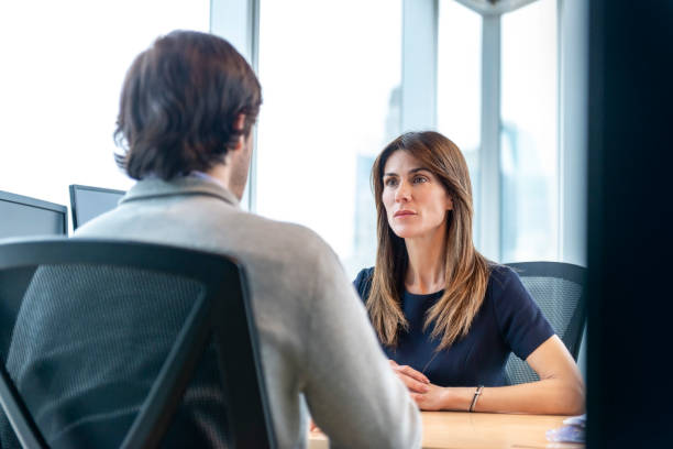 istock Woman Interviewing a man for a job 1179595920