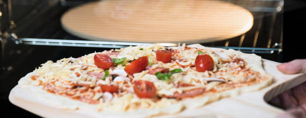 istock making homemade Italian-style pizza 1179596218