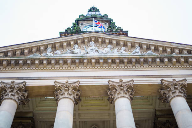 Traffic speeds past Birmingham's town hall. 
