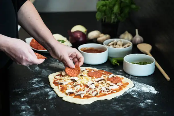 making homemade Italian-style pizza