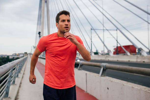 istock Young athlete sprinting on the bridge 1179597657