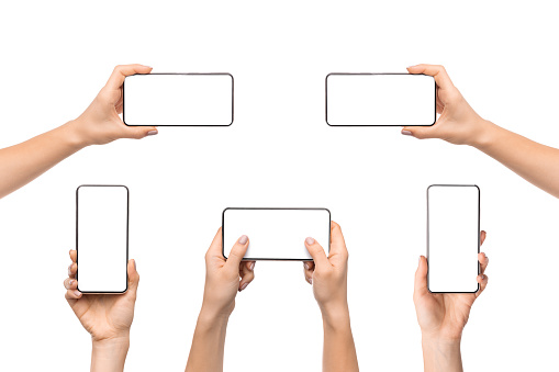 Collection of female hands holding smart phone with empty screen