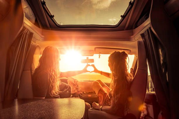 Dear Couple in camper at sunset in romantic mood