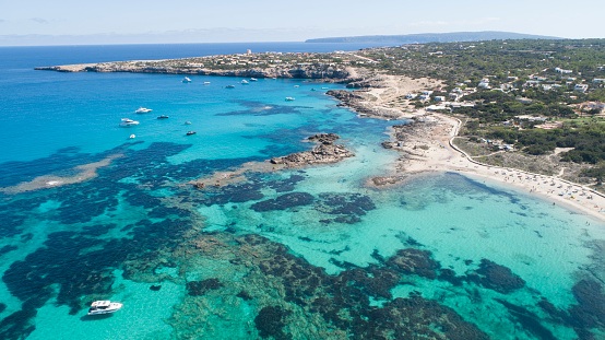 Turquoise water landscape with small cliffs on the island of Formentera