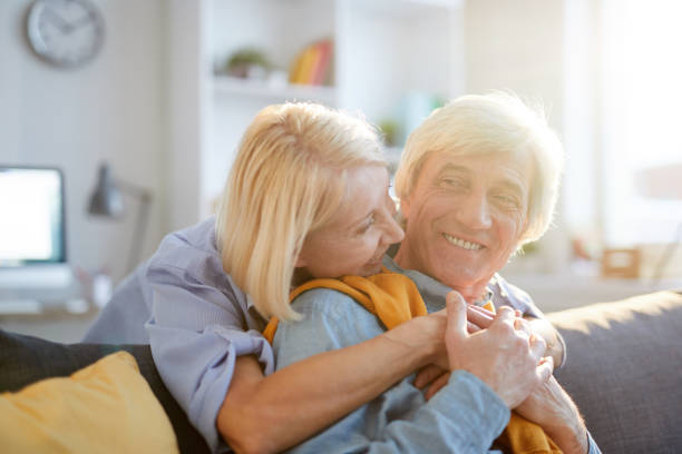 istock Happy Senior Couple Embracing in Sunlight 1179598625
