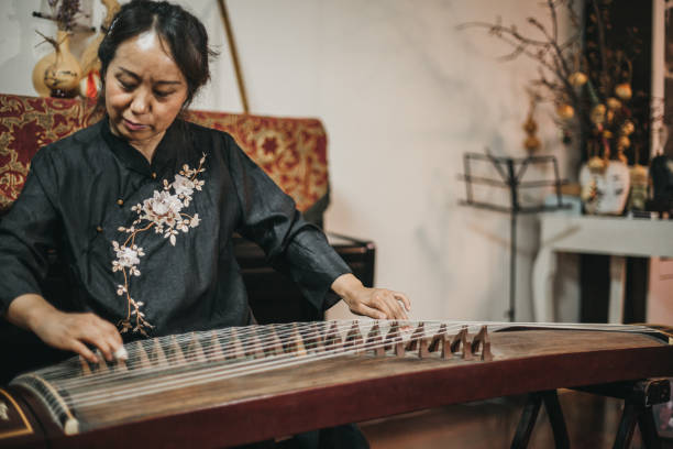 istock Senior Woman Practicing on Chinese Traditional Harp 1179598806