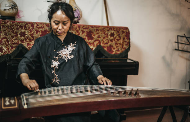 istock Senior Woman Practicing on Chinese Traditional Harp 1179598854