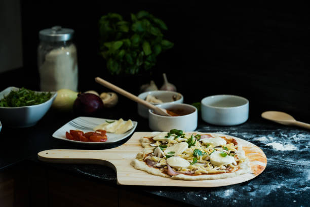 istock making homemade Italian-style pizza 1179599490