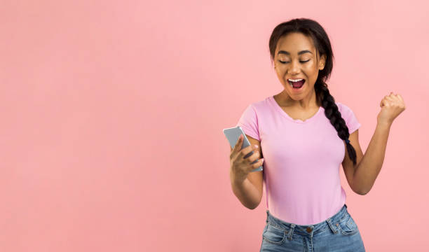 istock Excited girl using phone and reading sms with triumph 1179600288