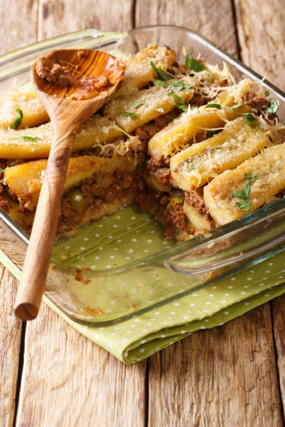 istock pastelon (puerto rican sweet plantain lasagna) close-up of a baking dish. vertical 1179600537