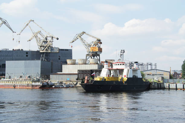 istock Black cargo ship arrived at the port 1179600739