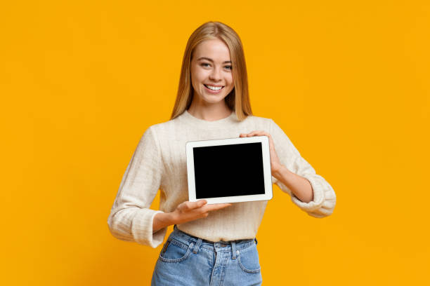 istock Digital tablet with black blank screen in young girl's hands 1179602614