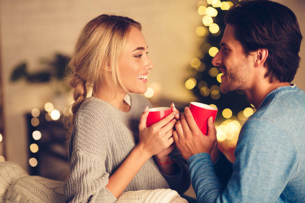 istock Couple in love drinking tea and enjoying winter holidays 1179604465
