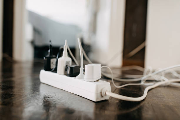 too many wall chargers - wired imagens e fotografias de stock