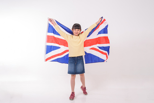 Teenager cheering with United Kingdom flag