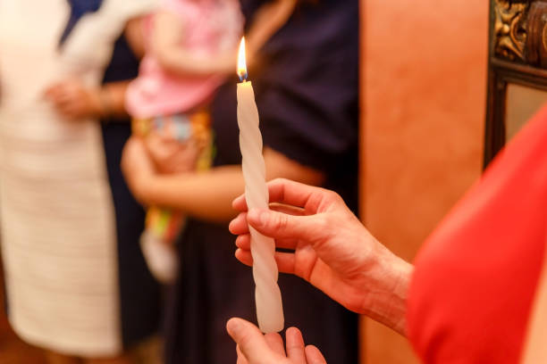 istock burning candle in women's hands 1179607121