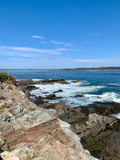 istock Waves crashing against the rocky coastline 1179607603