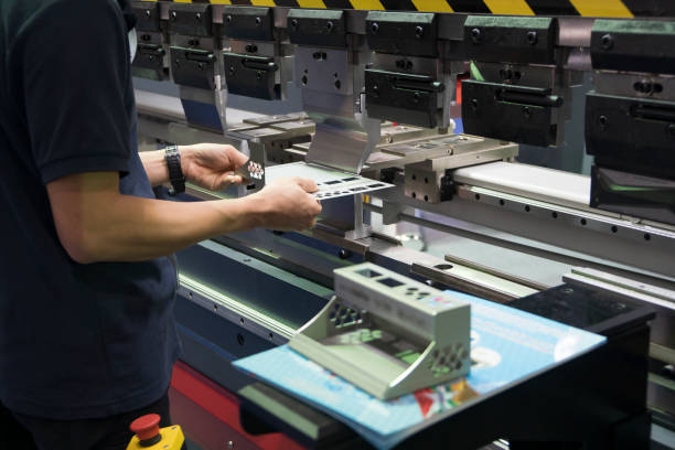 istock Operation of hydraulic bending machine with forming die by skill operator. 1179609036