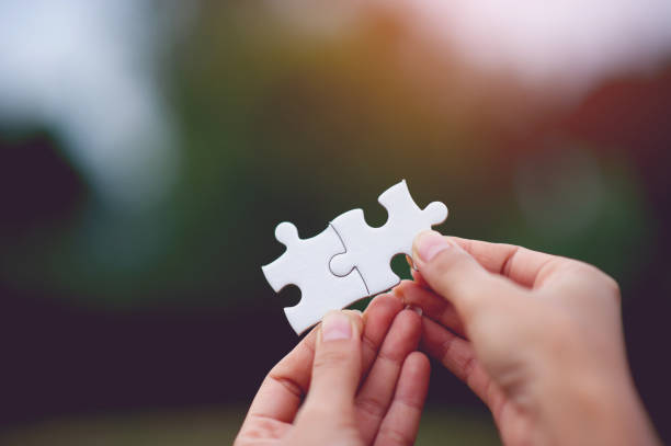 istock Hands and puzzles, important pieces of teamwork Teamwork concept 1179609223