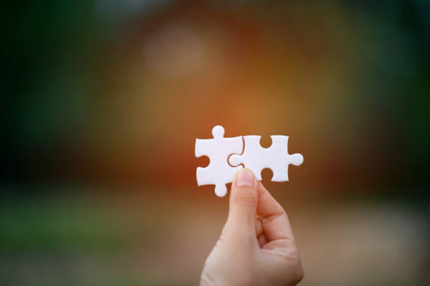 istock Hands and puzzles, important pieces of teamwork Teamwork concept 1179609250