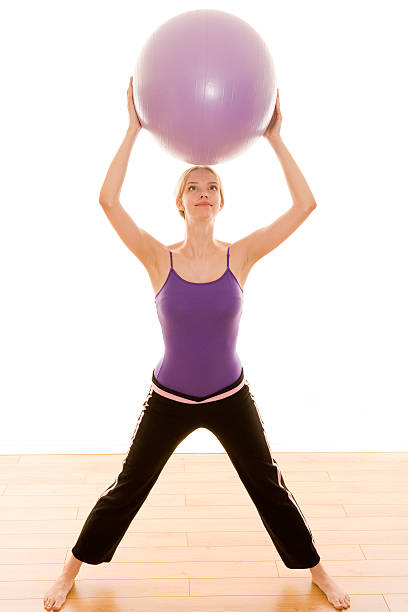 istock Female working out with an excercise ball 117960937