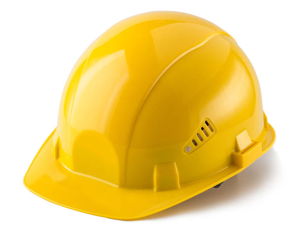 Construction helmet construction helmet, yellow, isolated, white background hard hat stock pictures, royalty-free photos & images