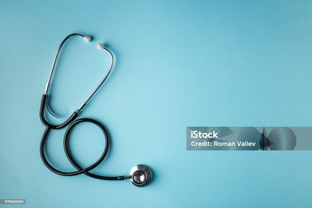 Black stethoscope on blue background stethoscope, black, blue background, isolated Healthcare And Medicine Stock Photo