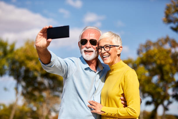 istock senior couple taking selfie happy elderly retired 1179610964