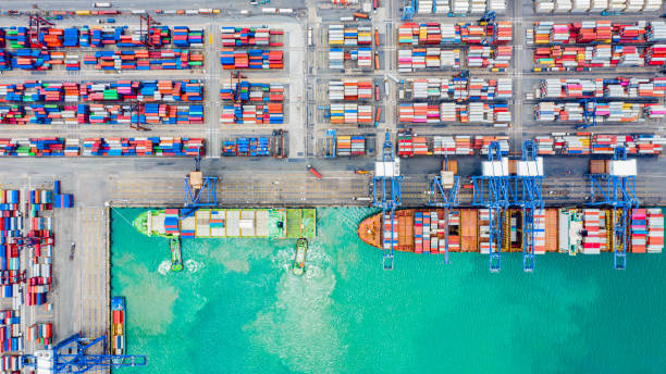 istock Top view of Deep water port with cargo ship and containers. It is an import and export cargo port where is a part of shipping dock and export products worldwide 1179611304