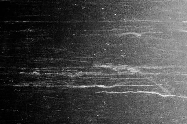istock Wall grunge black concrete with light background. Dirty wall concrete blackboard texture and splash white color or abstract background. 1179611308