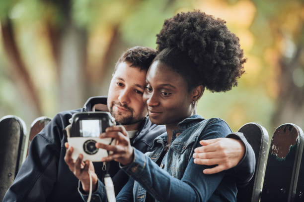 istock Girlfriend and boyfriend taking instant pictures 1179611457